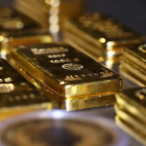 Gold climbs as traders position for Powell's speech