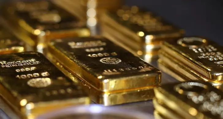 Gold climbs as traders position for Powell's speech