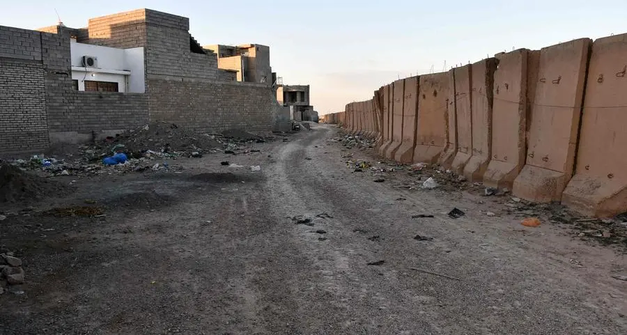 Years after civil war, security wall holds back Iraqi city