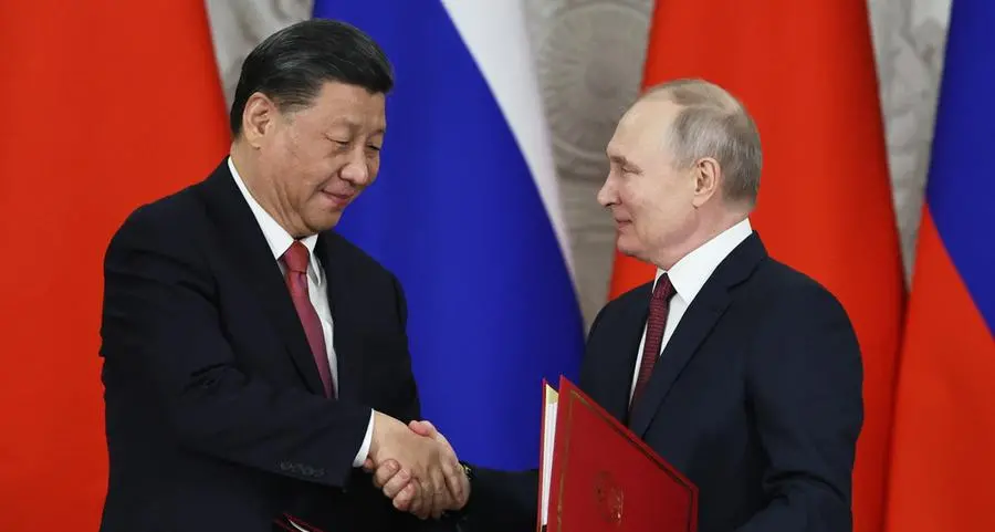 Xi urges Shanghai alliance solidarity, Putin praises support