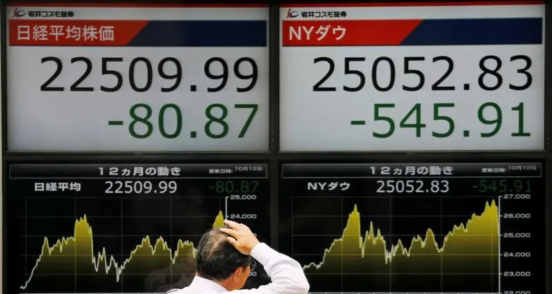 Nikkei inches down as investors pause rally, posts 6th straight monthly gain