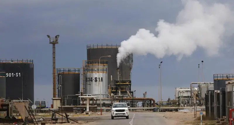 Oil dips, set for monthly drop, ahead of key U.S. inflation data