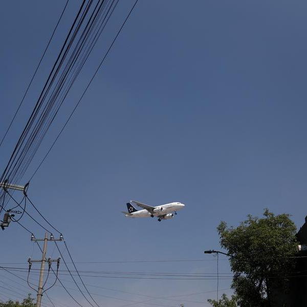 Mexico to cap flights to main airport, use new hub more after incidents