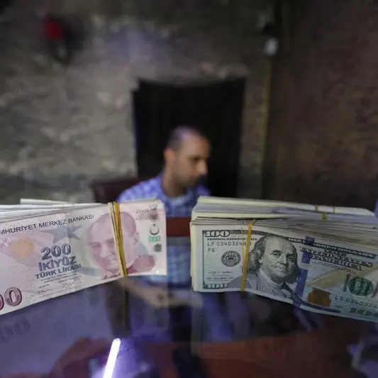 Turkey's lira slips to record low, stocks tumble