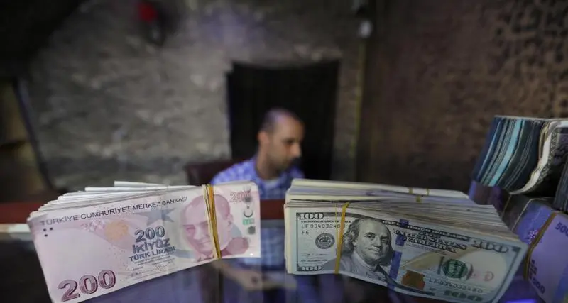 Turkey's lira slips to record low, stocks tumble