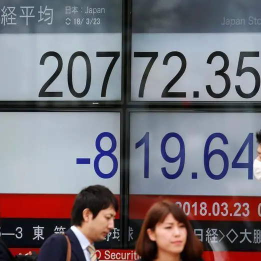 Nikkei ends at 34-year high on tech gains, weaker yen