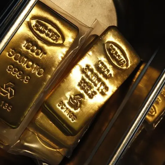 Gold eyes weekly gain as dollar slips after U.S. GDP data
