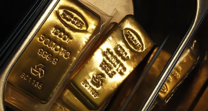 Gold eyes weekly gain as dollar slips after U.S. GDP data