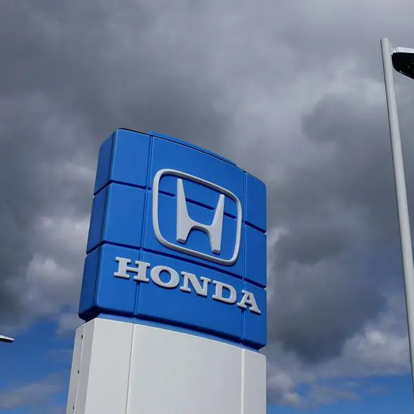 Honda posts record profit, issues cautious forecasts