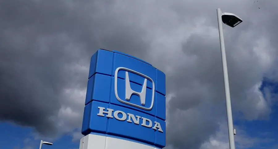 Honda posts record profit, issues cautious forecasts