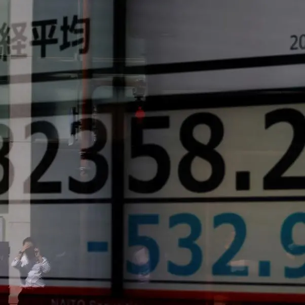 Japan's Nikkei hits 34-year peak but retreats as investors take profits