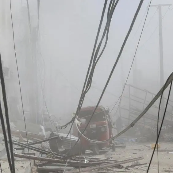 Car bombs at busy Somalia market intersection killed at least 100, president says