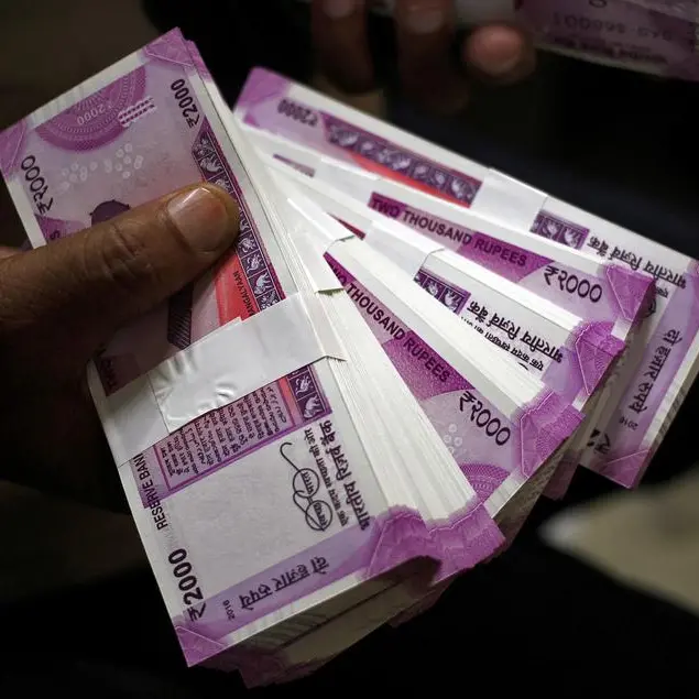 Indian rupee ends moderately higher as oil firms' dollar bids curb upside