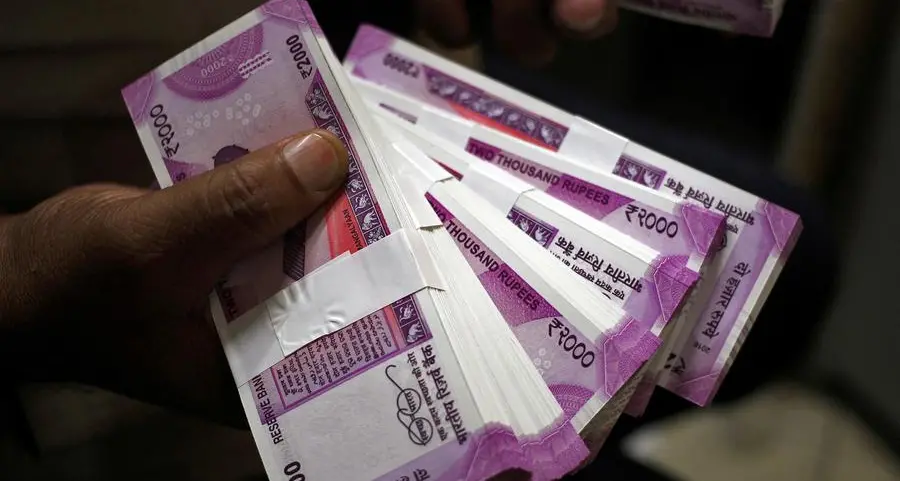 Indian rupee ends moderately higher as oil firms' dollar bids curb upside