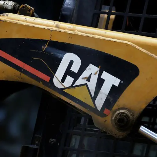 Caterpillar profit slides as costs and forex squeeze margins, shares down\n