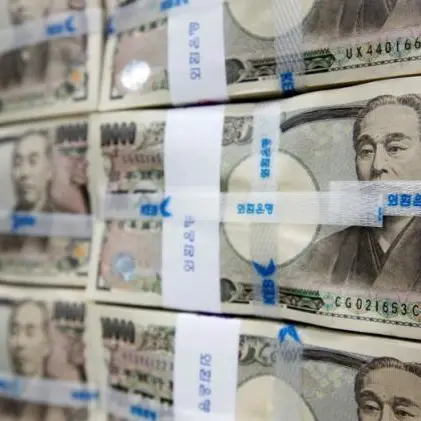 Japan's policymakers hold fire as yen enters intervention range