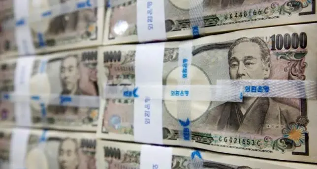 Japan's policymakers hold fire as yen enters intervention range