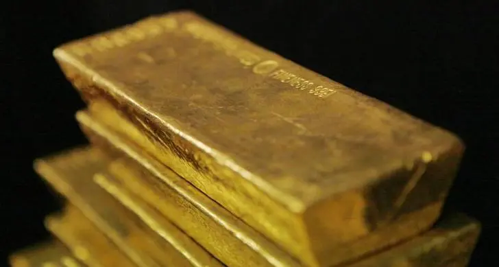 Gold rises as weaker dollar boosts bullion appeal, higher yields cap gains