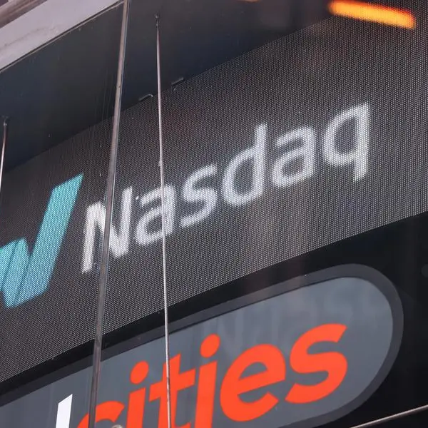 Nasdaq edges to record while Dow pulls back