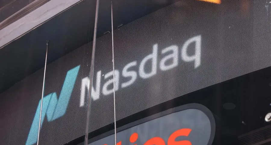 Nasdaq edges to record while Dow pulls back