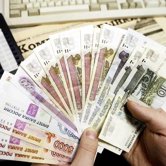 Russian rouble eases towards 61 vs dollar, stocks up