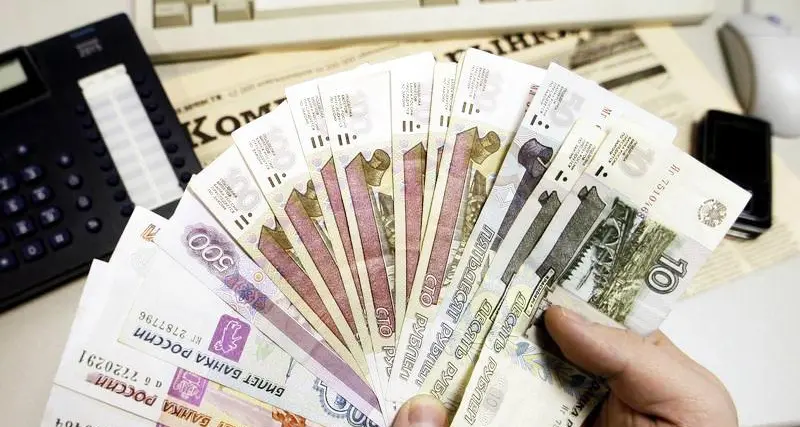 Russian rouble eases towards 61 vs dollar, stocks up