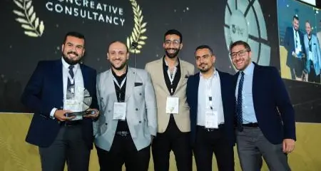 \"Con Creative\" celebrates receiving the award for the best engineering company in Egypt