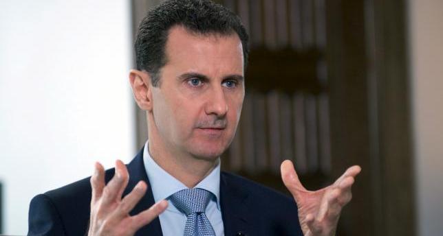 Syria Assad stops speech due to low blood pressure before resuming -state TV