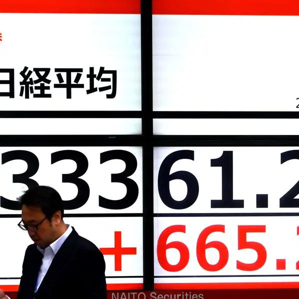 Tokyo shares jump on tech rally, easy money stance