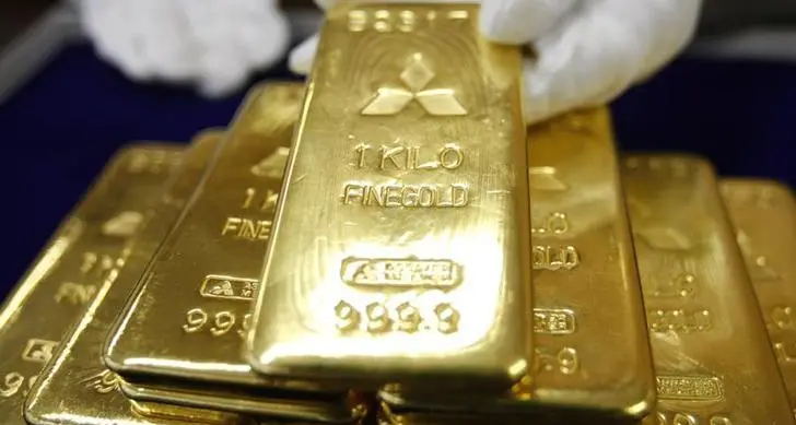 Gold touches record high on rate-cut bets, weaker US dollar