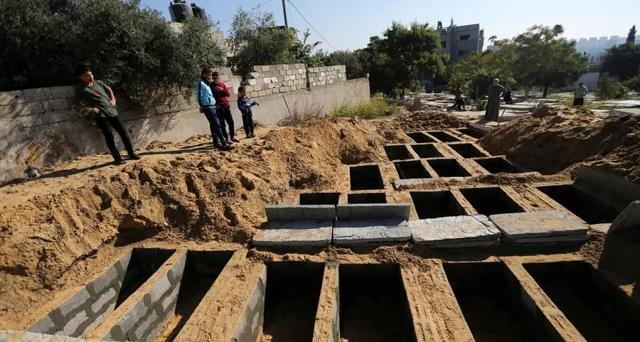 Palestinians bury 21 people killed in Gaza fire