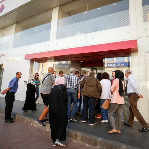 Depositors, some armed, storm 3 Lebanese banks over withdrawal limits
