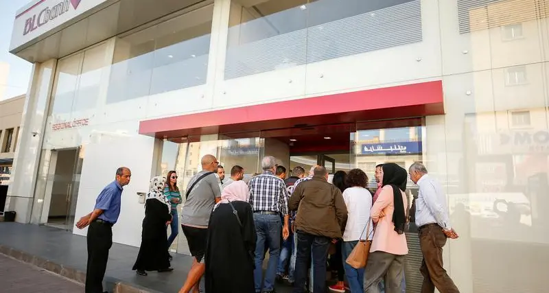 Depositors, some armed, storm 3 Lebanese banks over withdrawal limits