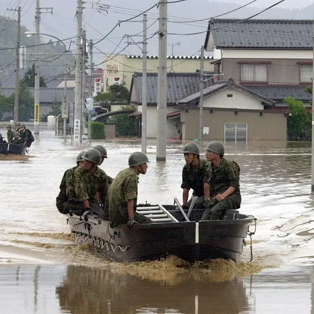 Rescuers comb muddy riverbanks after Japan floods kill six