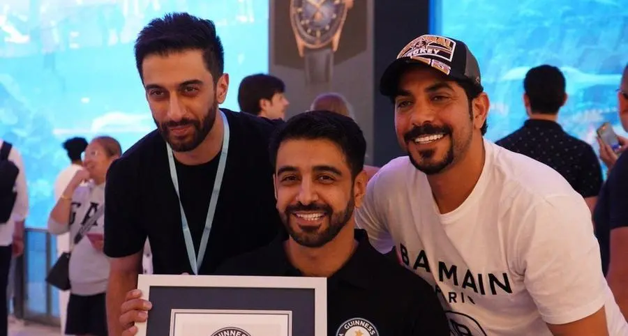 Faisal Al Mosawi sets a new Guinness World Record for fastest dive with underwater wheelchair at Dubai Aquarium