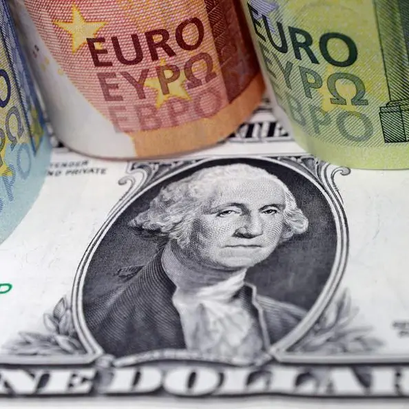 Dollar slides on expectations of less hawkish Fed, euro at 1-month high