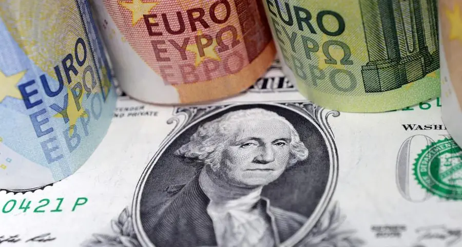 Dollar slides on expectations of less hawkish Fed, euro at 1-month high