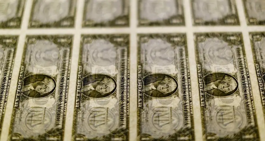 Dollar edges higher, buoyed by monetary policy imbalance