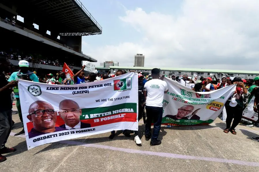 Supporters hold a banner of candidate Peter Obi and running mate Datti Baba-Ahmed of the Labour Party during a campaign rally in Lagos, on February 11, 2023. (Photo by PIUS UTOMI EKPEI / AFP)