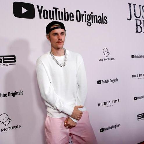 Justin Bieber says he's working to recover from partial face paralysis