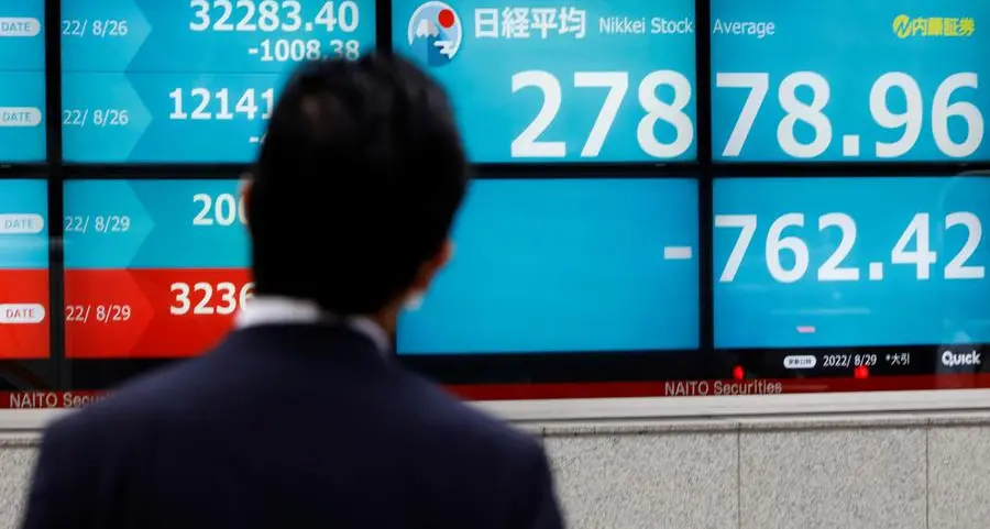 Japan's Nikkei ends firmer as investors buy shares after sharp drop