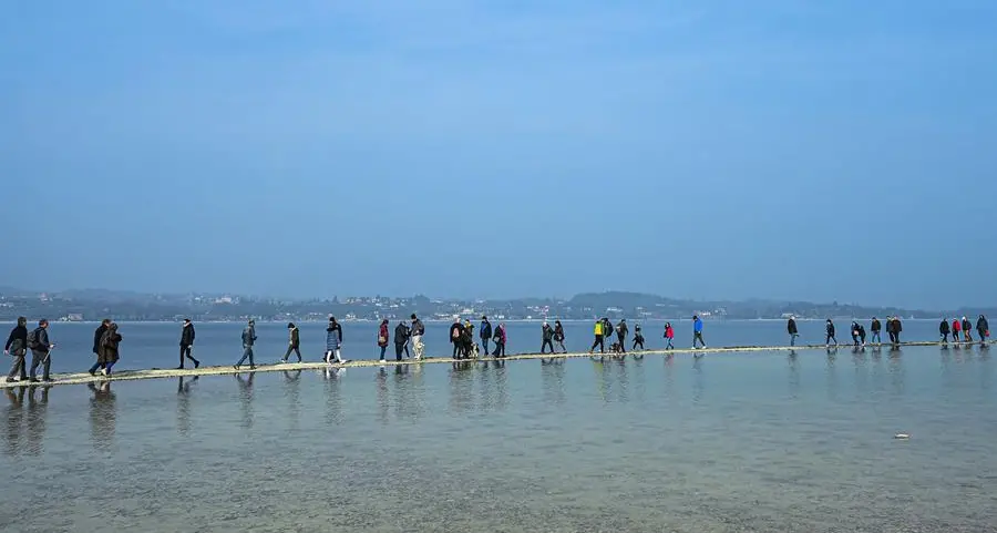 Lake Garda tourists flock to island reconnected by drought