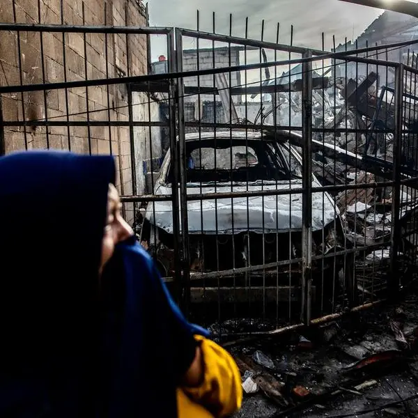 Indonesians search charred homes after fuel depot fire kills 17