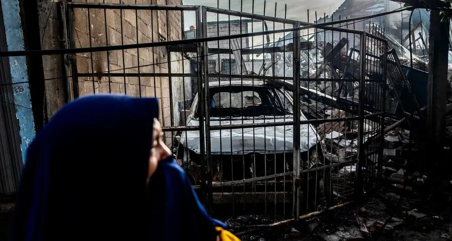 Indonesians search charred homes after fuel depot fire kills 17