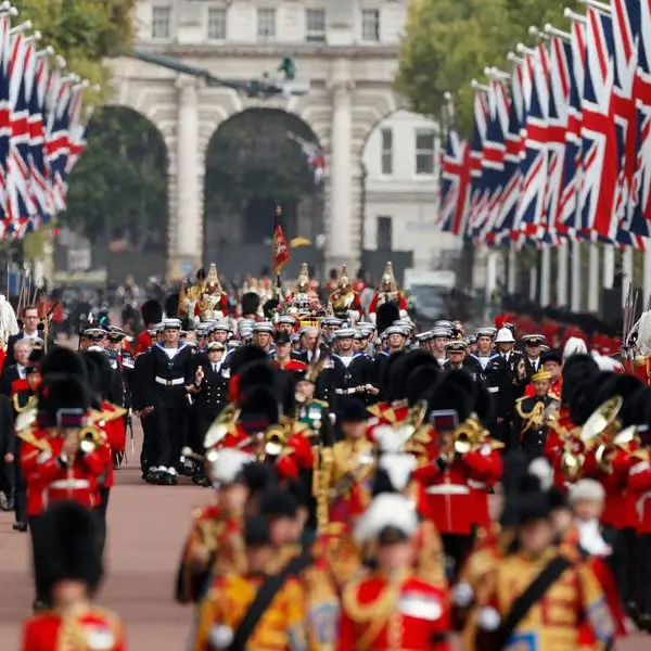Huge crowds follow queen's funeral in silence and awe