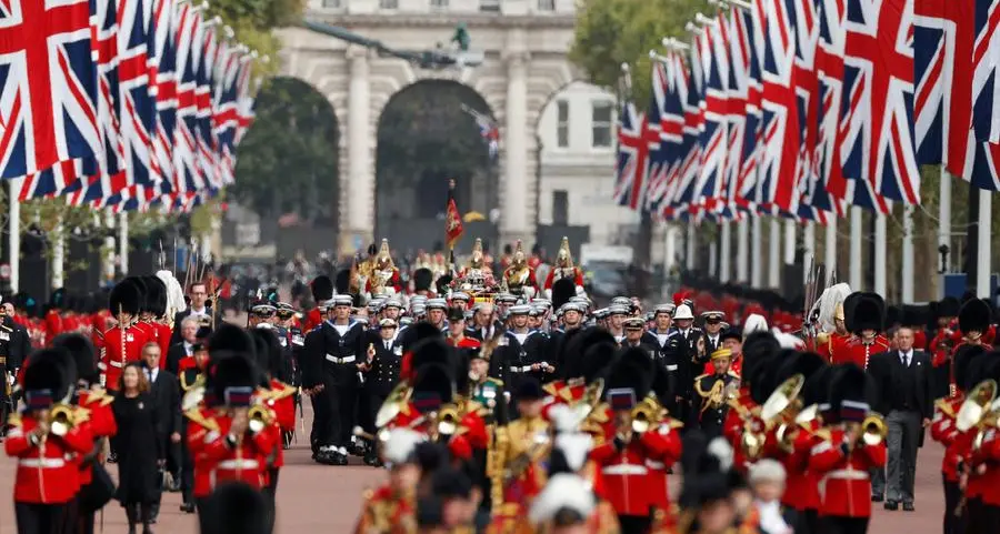 Huge crowds follow queen's funeral in silence and awe