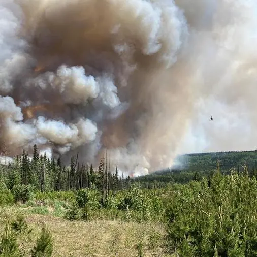 Wildfires spread in British Columbia, Quebec sees signs of progress