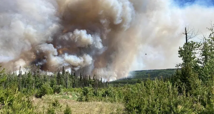 Wildfires spread in British Columbia, Quebec sees signs of progress