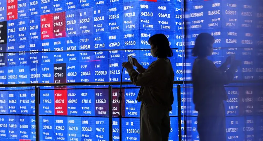 Stocks sink, oil surges as Trump vows to keep hitting Iran