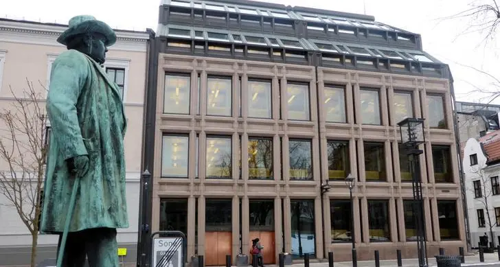 Norway central bank keeps rate on hold in policy reversal